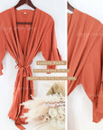 Modern Luxury Limited Edition Terracotta / Rust / Burnt Orange Large Gift Box for Bridesmaid Gifts. Includes Rust Robe, personalized champagne glass, scented candle, matches, organic soap, satin hair scrunchie, satin eye mask.