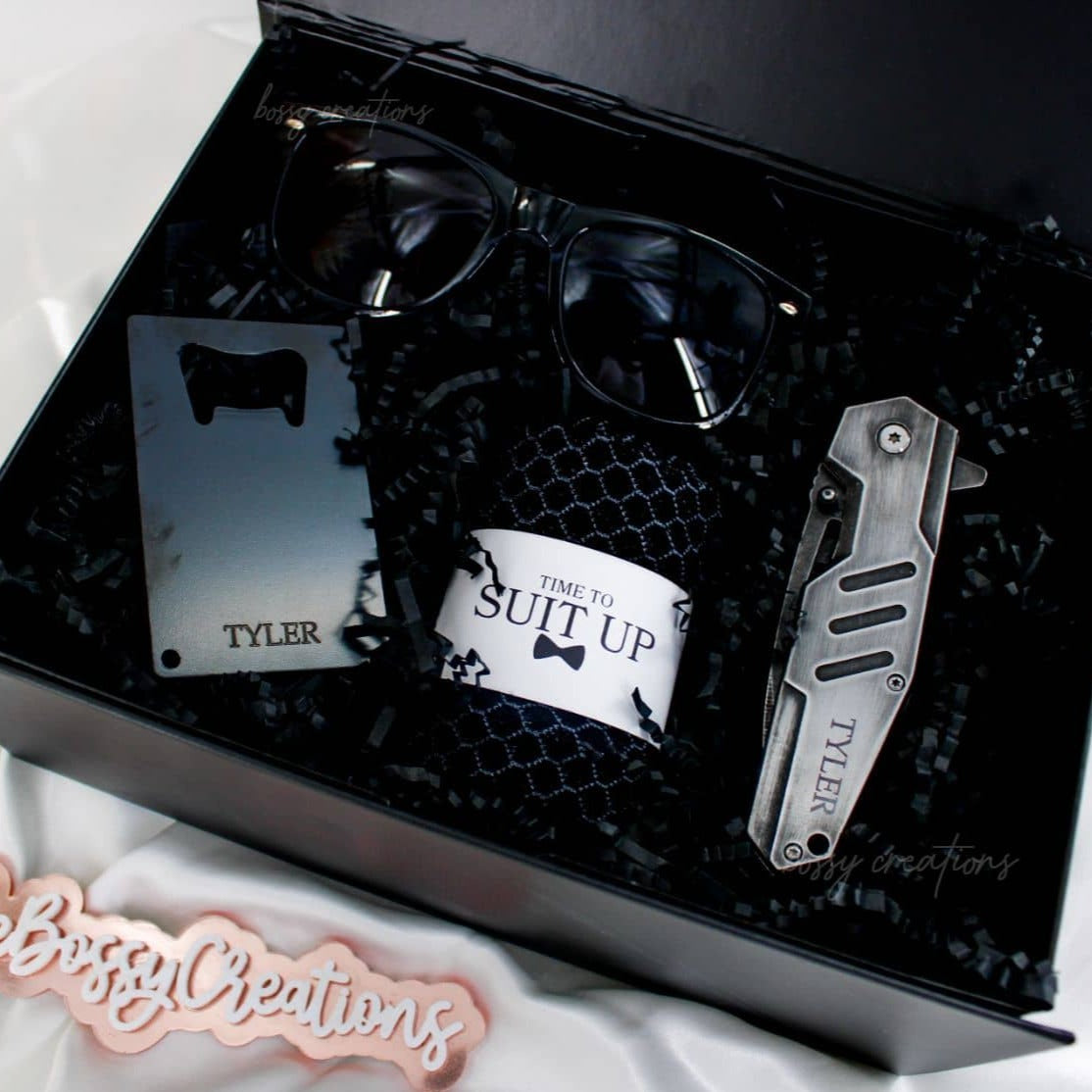 Groomsmen & Best Man Black Proposal Gift Boxes. Engraved pocket knife, engraved bottle opener, socks, and sunglasses. handmade by bossy creations